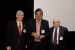 Prof. Grandon Gill, Chair of the Award Ceremony, and Dr. Nagib Callaos, General Chair, giving Dr. Karl H. Müller an award "In Appreciation for Co-Chairing and Co-Facilitating the Conversational Session on Inter-Disciplinary Communications and for Delivering a Great Keynote Address at a Plenary Session."